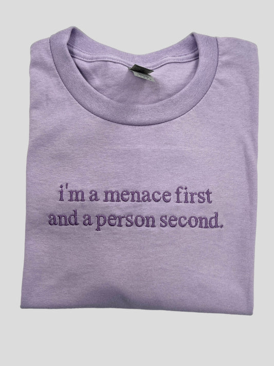 a purple t - shirt that says i'm a mence first and a