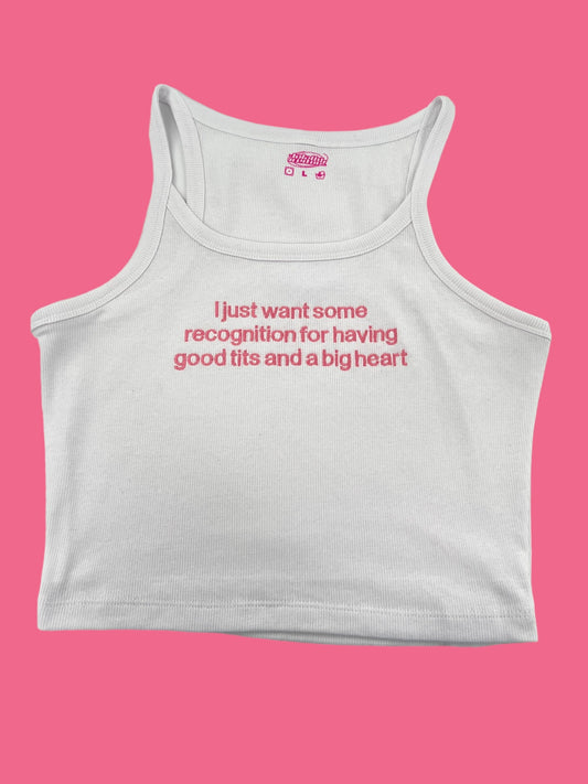 a white tank top with a pink background