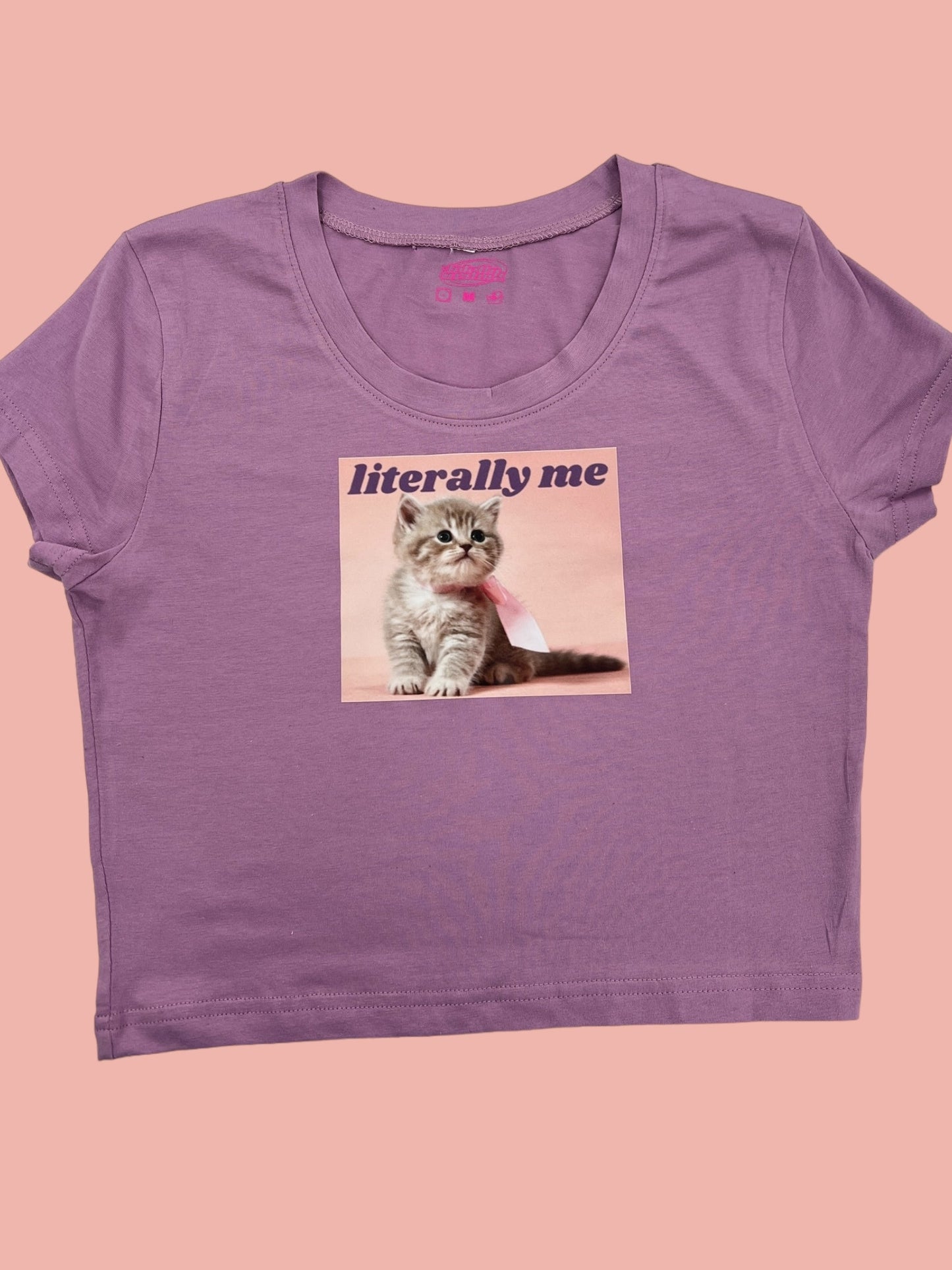 a women's purple t - shirt with a picture of a cat on it