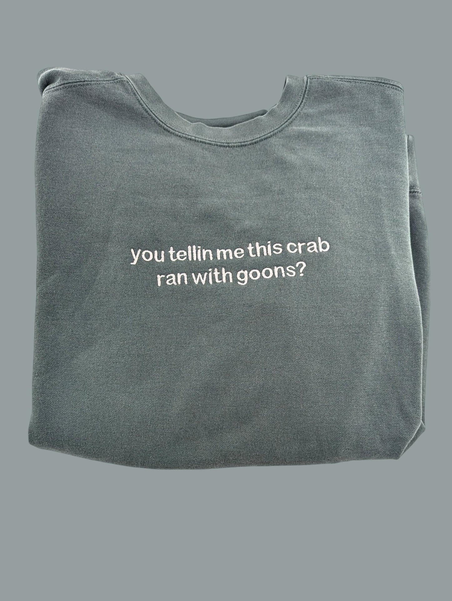 a gray t - shirt with white writing that says, you tell me this crab
