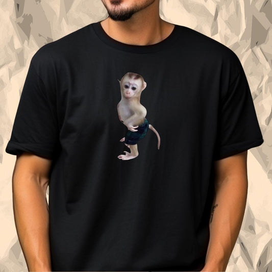 a man wearing a black shirt with a monkey on it