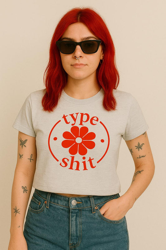 a woman with red hair wearing a type shit t - shirt