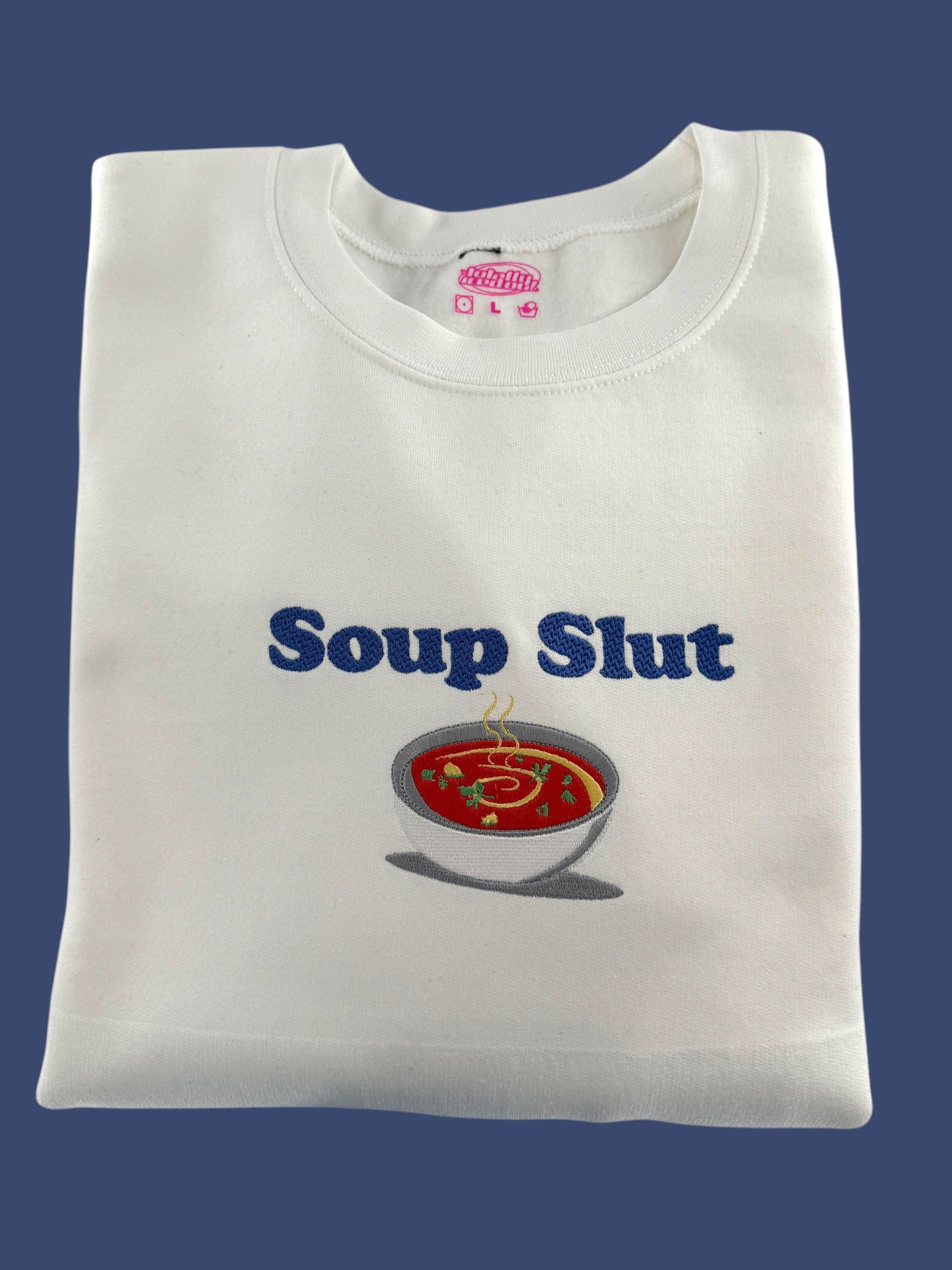 a white t - shirt with a soup logo on it