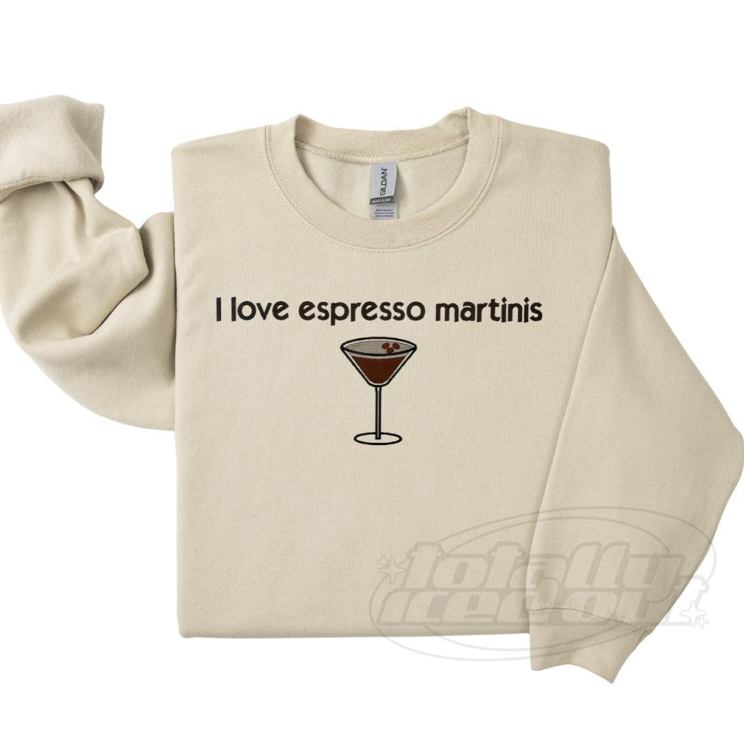 a white sweatshirt with a martini glass on it