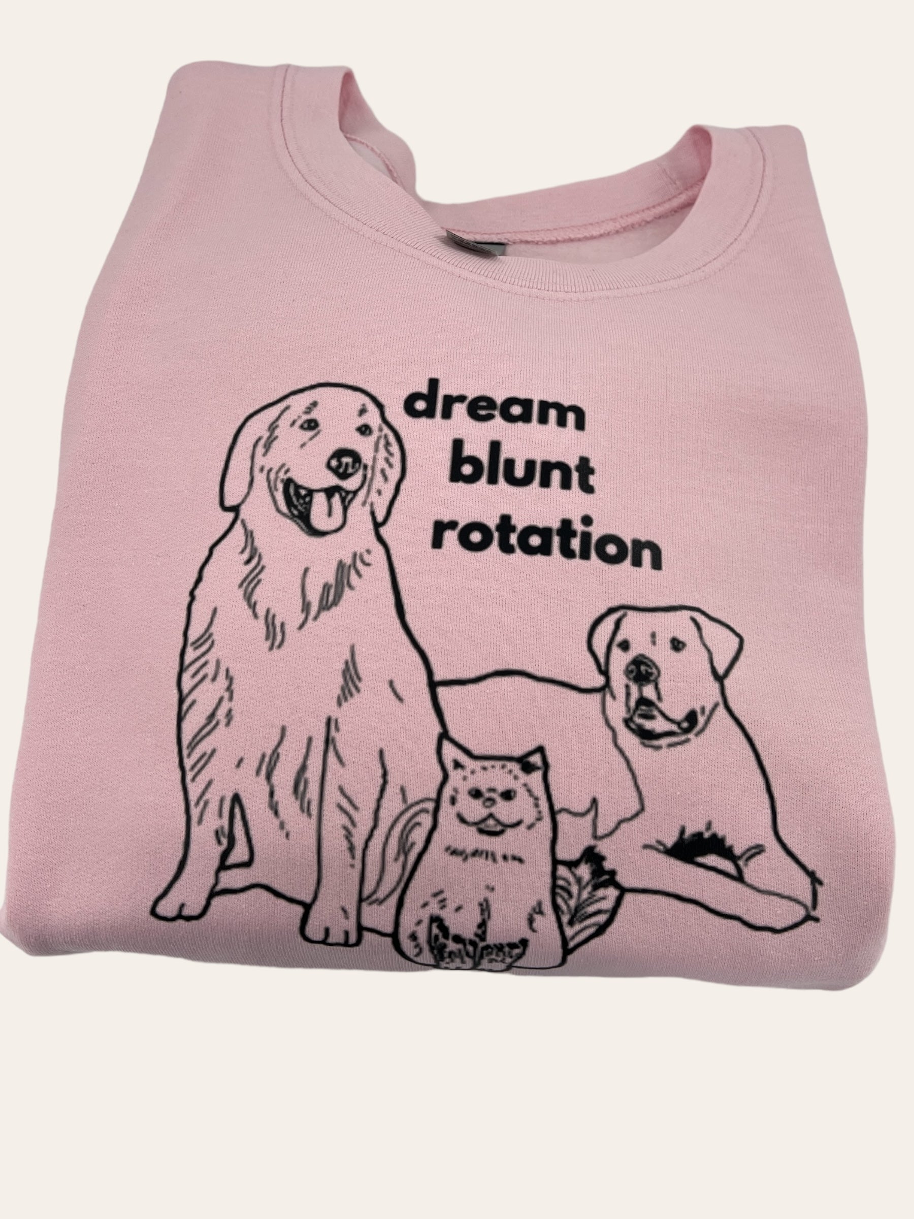 a pink shirt with two dogs and a cat on it