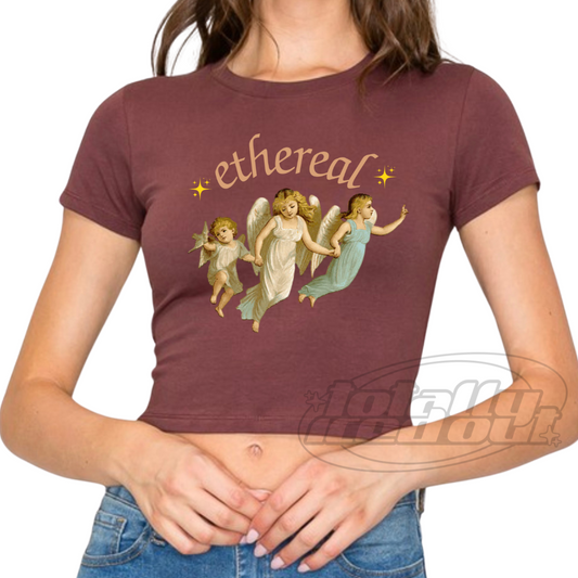 a woman wearing a t - shirt with angels on it