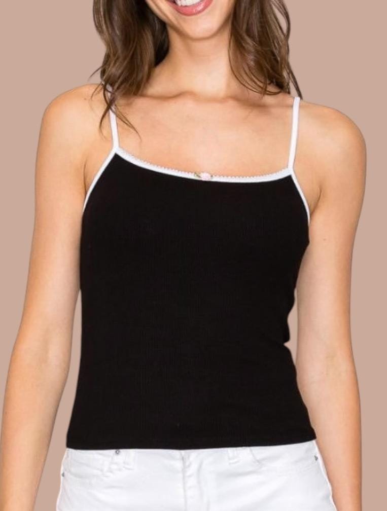 a woman wearing a black and white tank top