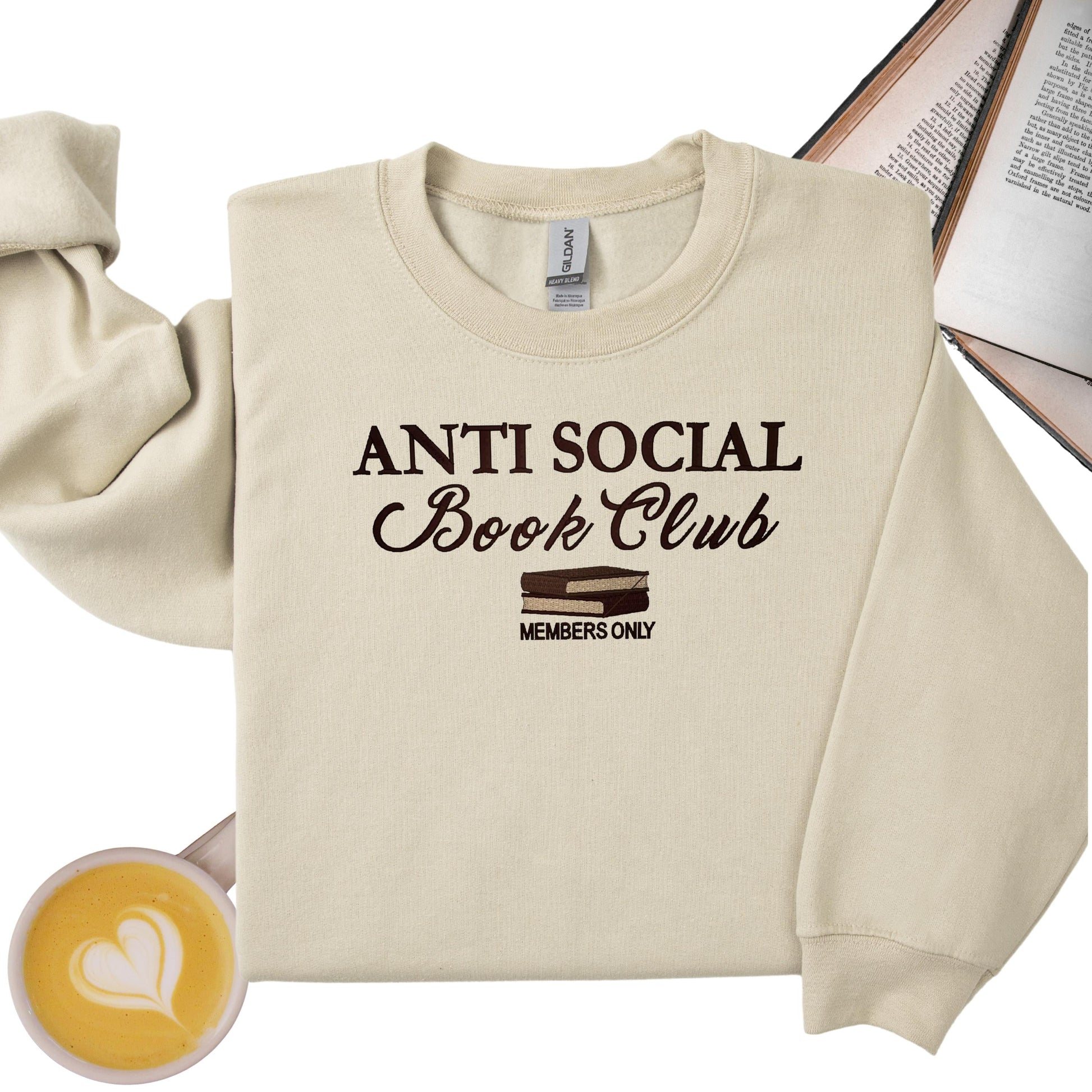 a sweater, a book and a cup of coffee