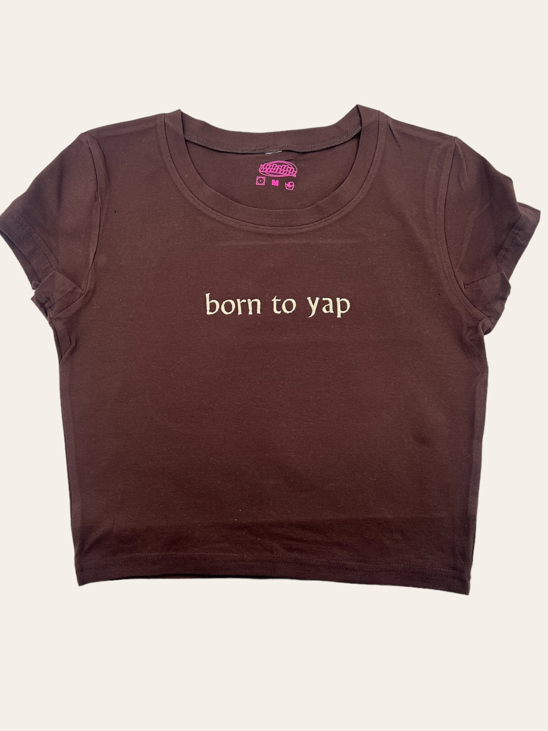 a brown shirt that says born to yap