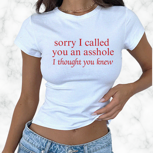 a woman wearing a t - shirt that says sorry i called you an asshole