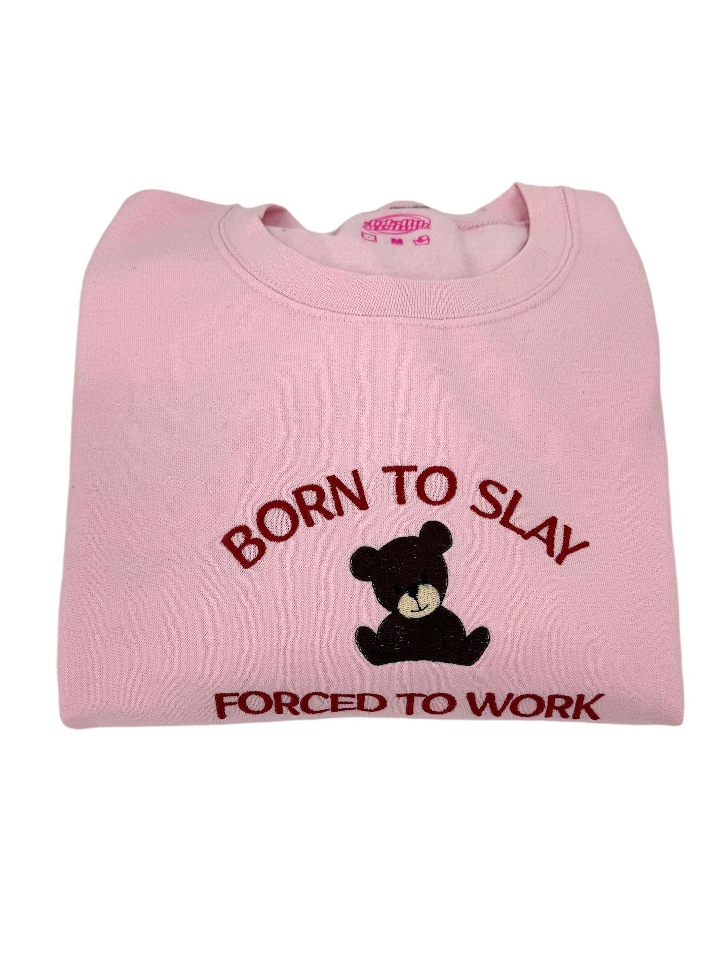 a pink t - shirt with a teddy bear saying born to slay forced to