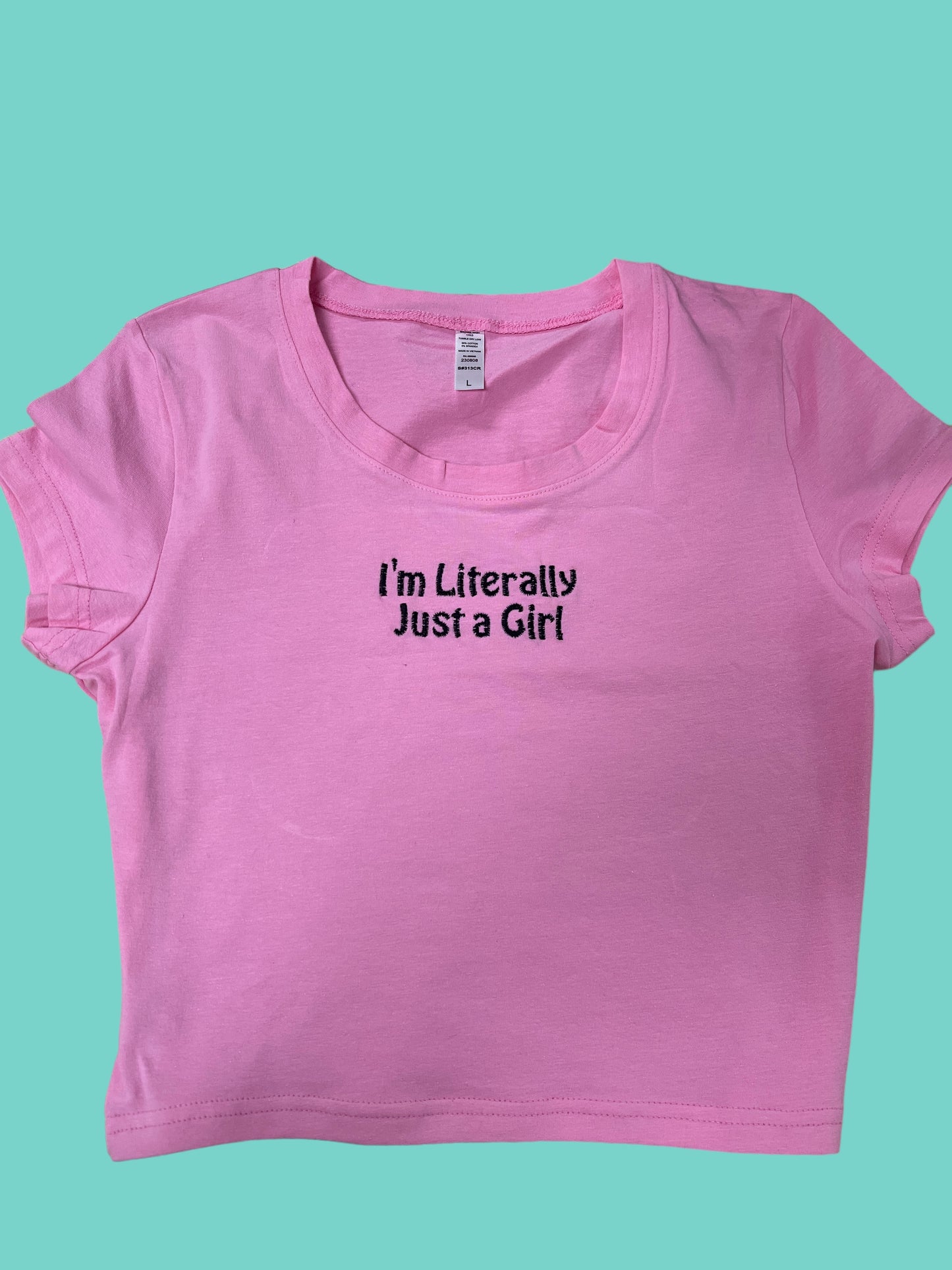 a pink shirt that says i'm literally just a girl