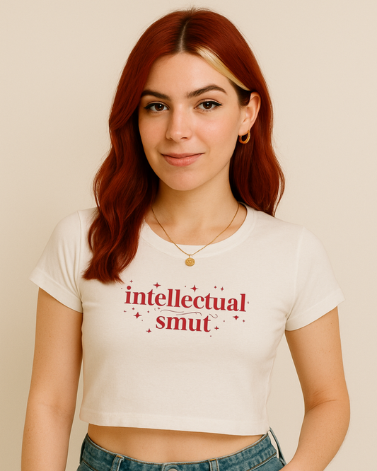 a woman with red hair wearing a white shirt