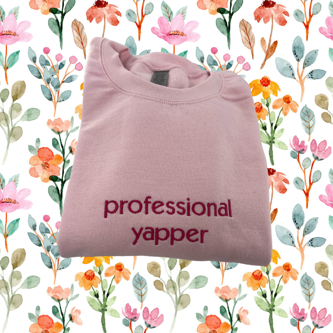 a pink t - shirt with the words professional yapper printed on it