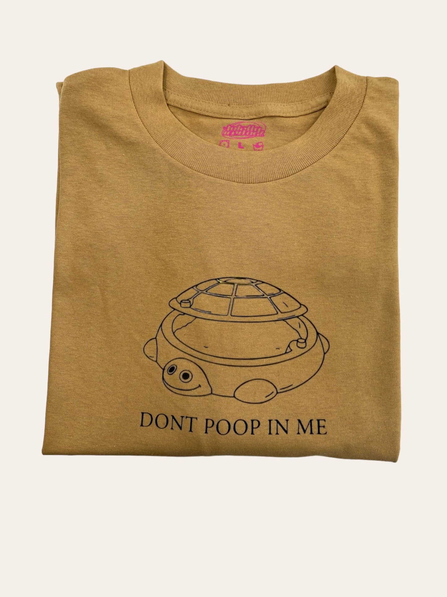 a t - shirt that says don&#39;t poop in me