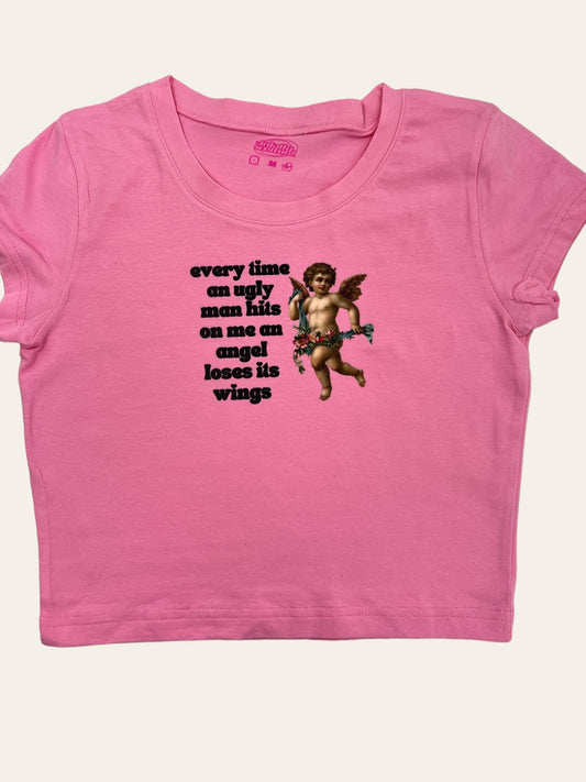 a pink shirt with an image of a cupid angel on it