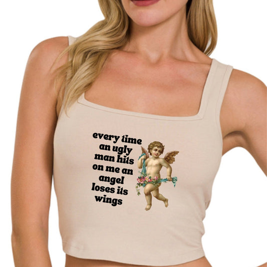 a woman wearing a tank top with a cupid on it