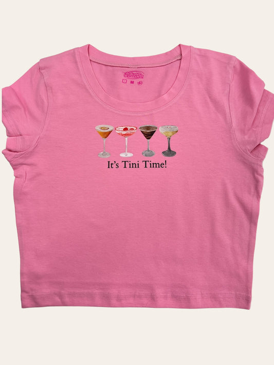 a pink shirt with two glasses of wine on it