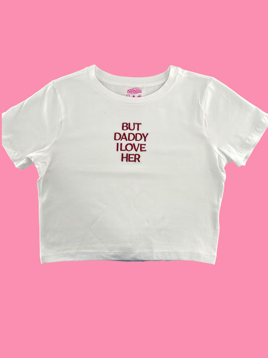 a white crop top that says, but daddy likes her