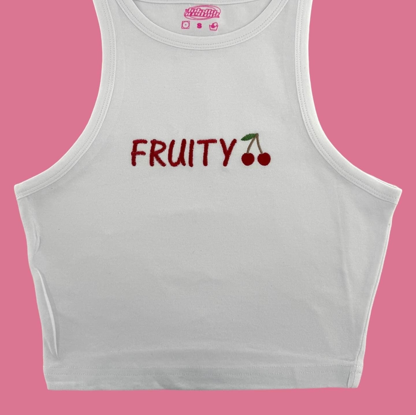 a white crop top with fruity written on it