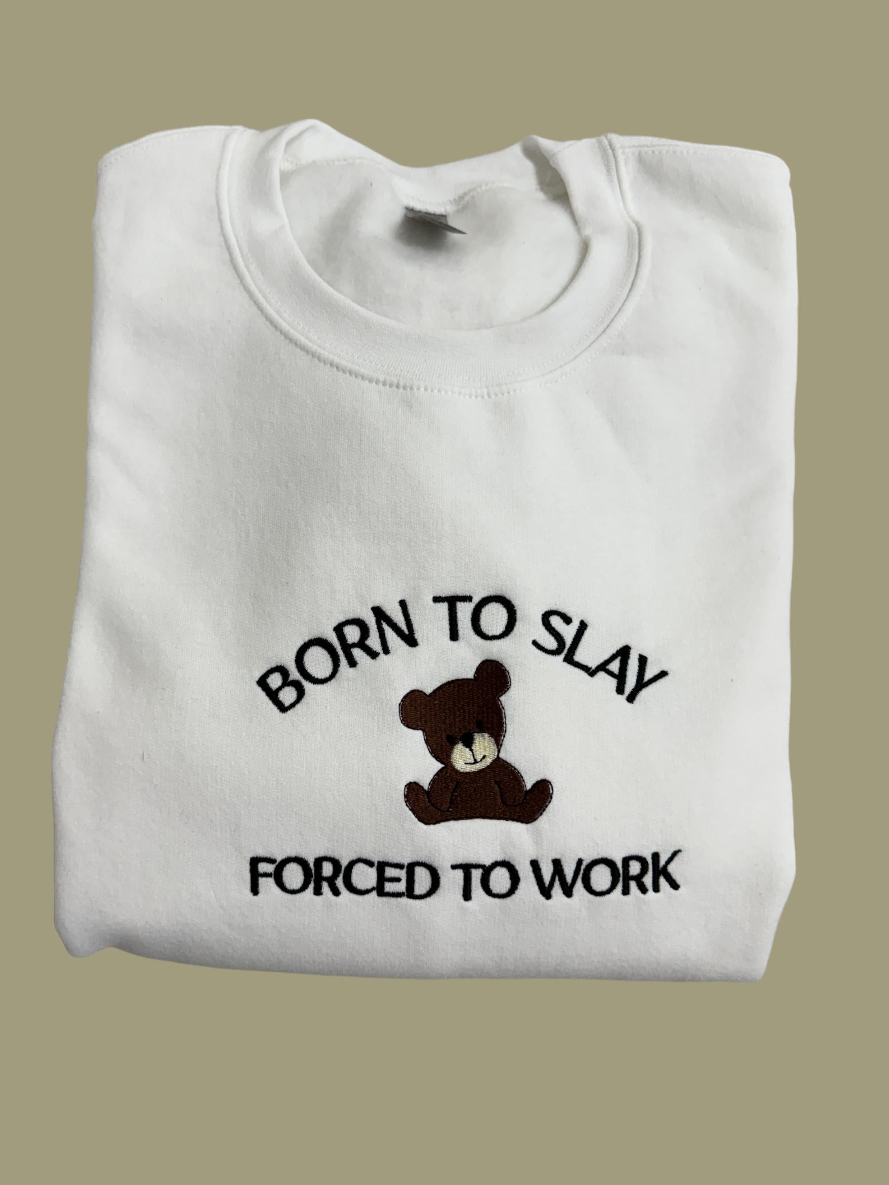 a white t - shirt with a teddy bear saying born to slay forced to