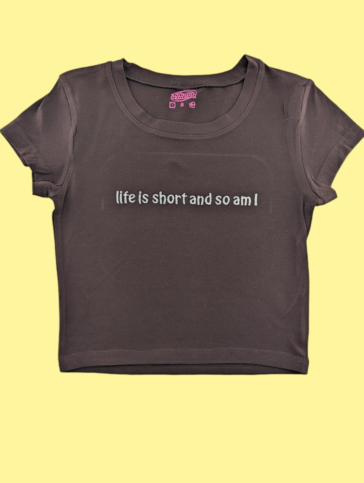 a t - shirt that says life is short and so am