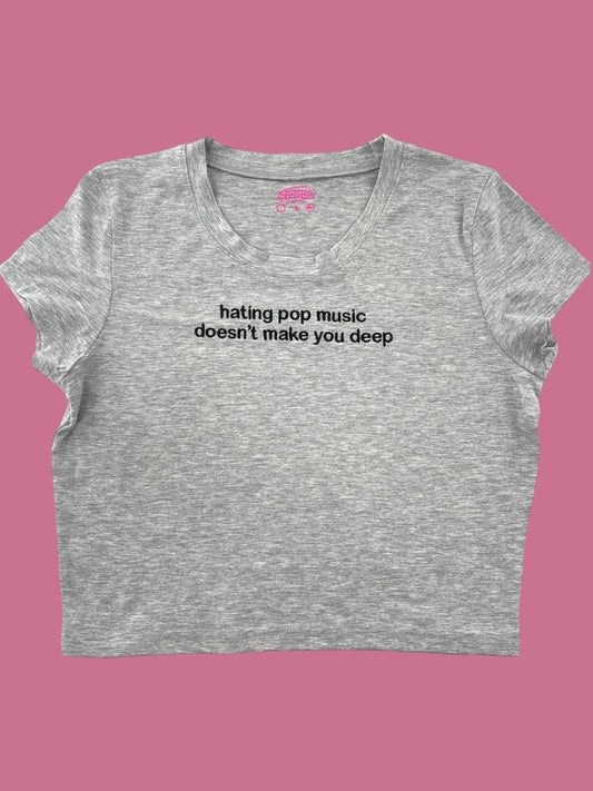 a women&#39;s crop top that says hating pop music doesn&#39;t make you