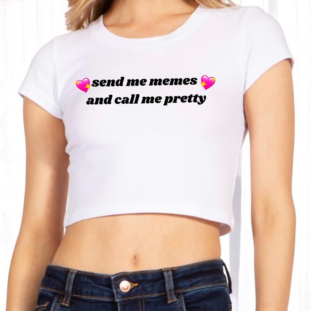 a woman wearing a white crop top that says send me memes and call me