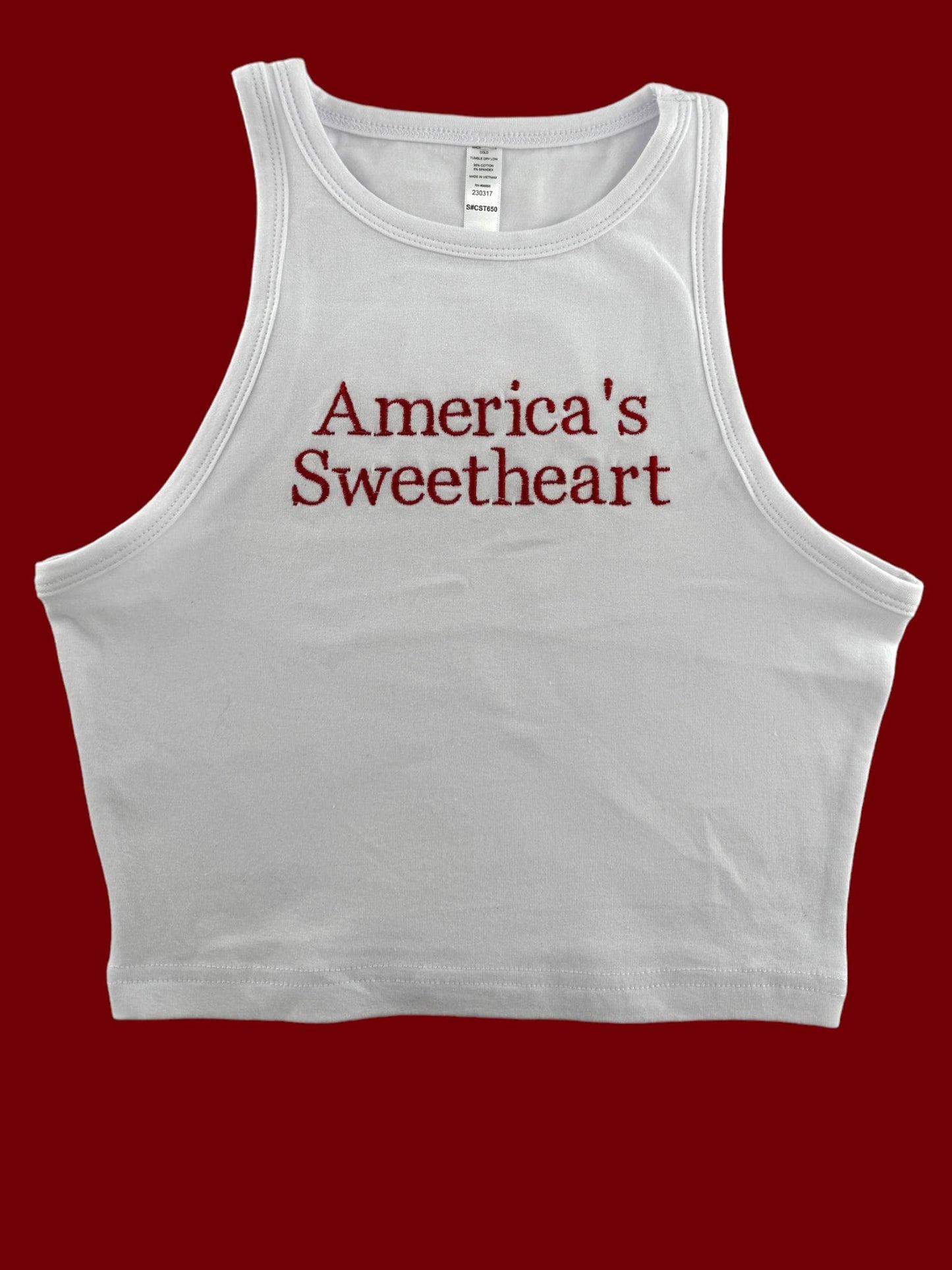 a white tank top with the words america&#39;s sweetheart on it