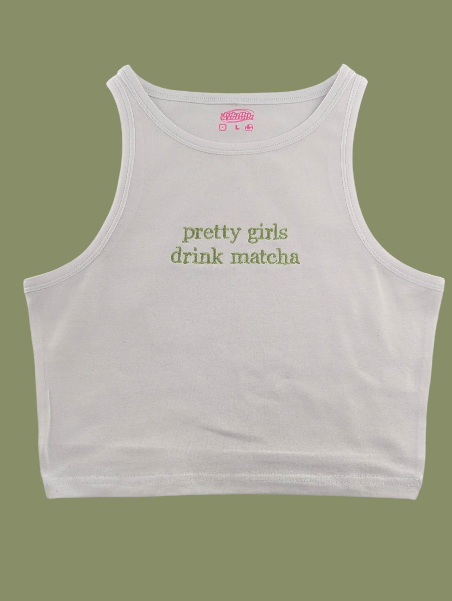 a white crop top that says pretty girls drink matcha