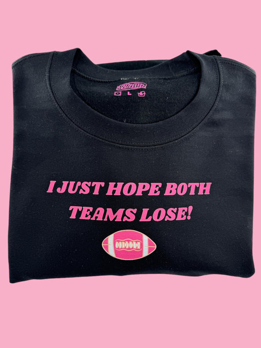 a black t - shirt with a pink football on it