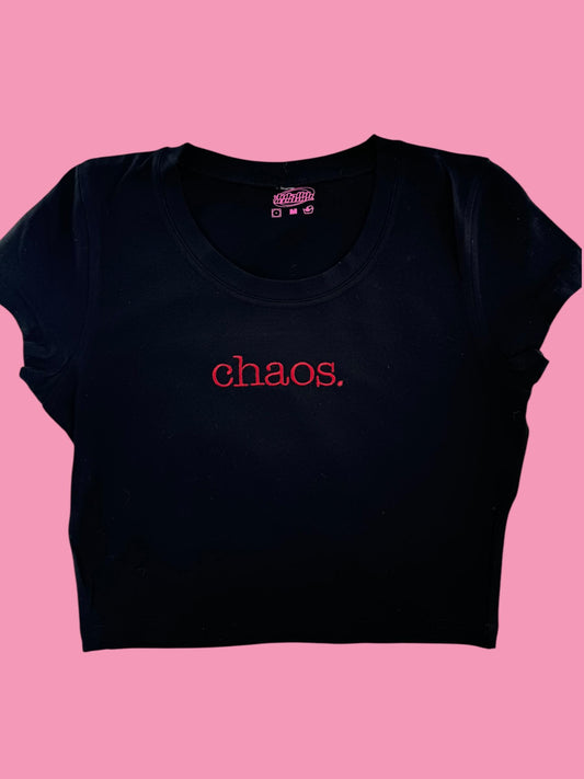 a black crop top with the word chaos printed on it