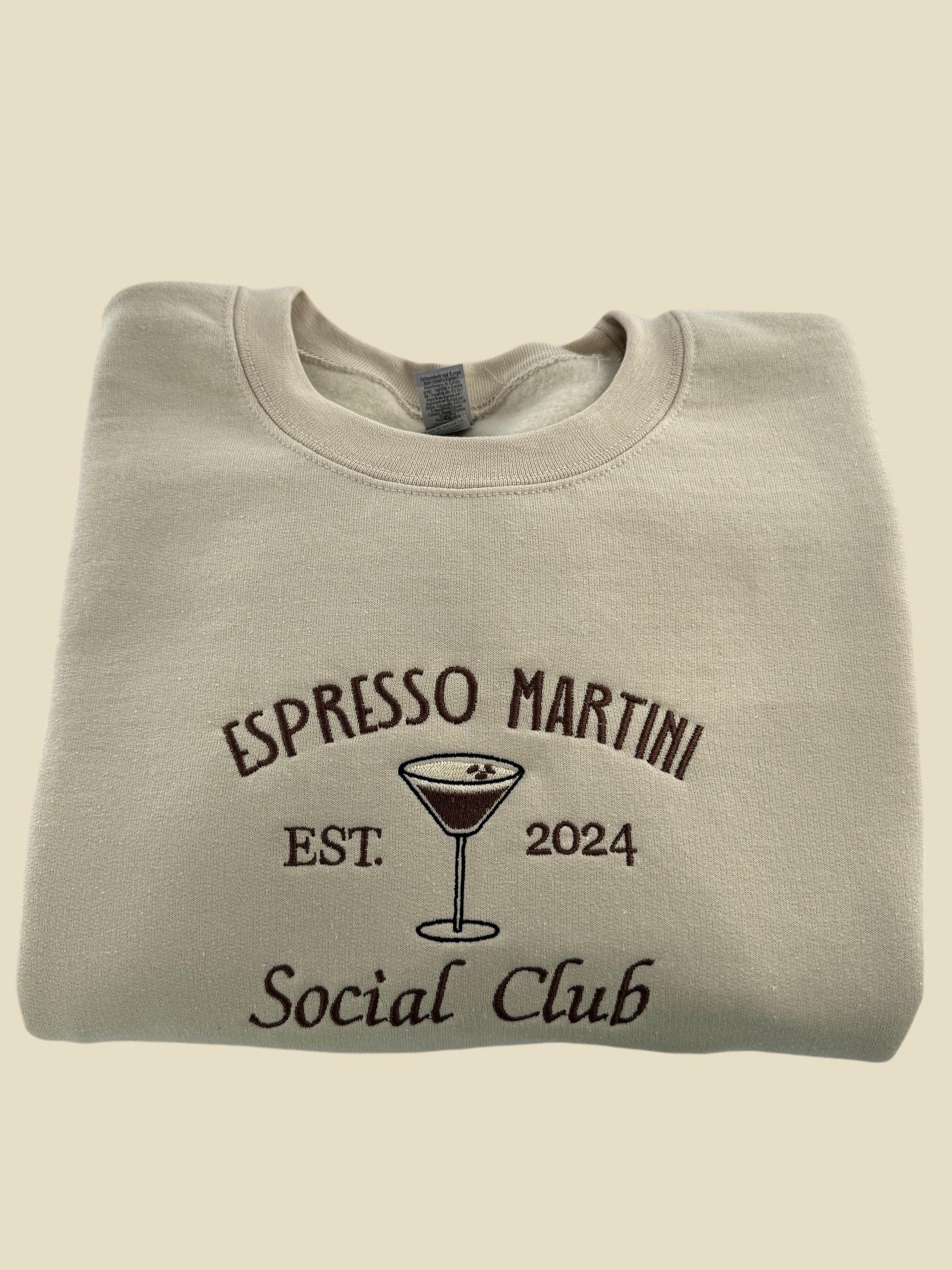 a white shirt with a martini glass on it