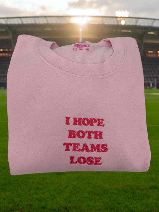 a pink t - shirt that says i hope both teams lose