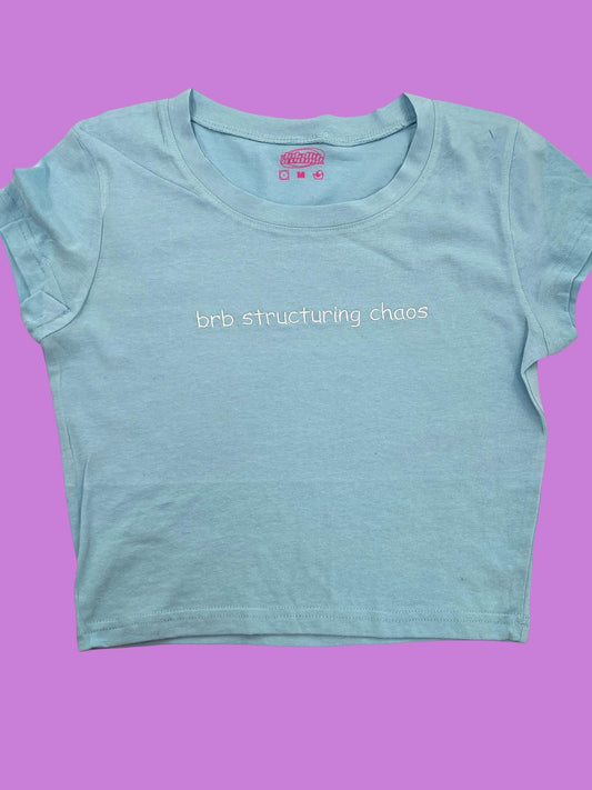 a t - shirt with the words bridling chaos printed on it