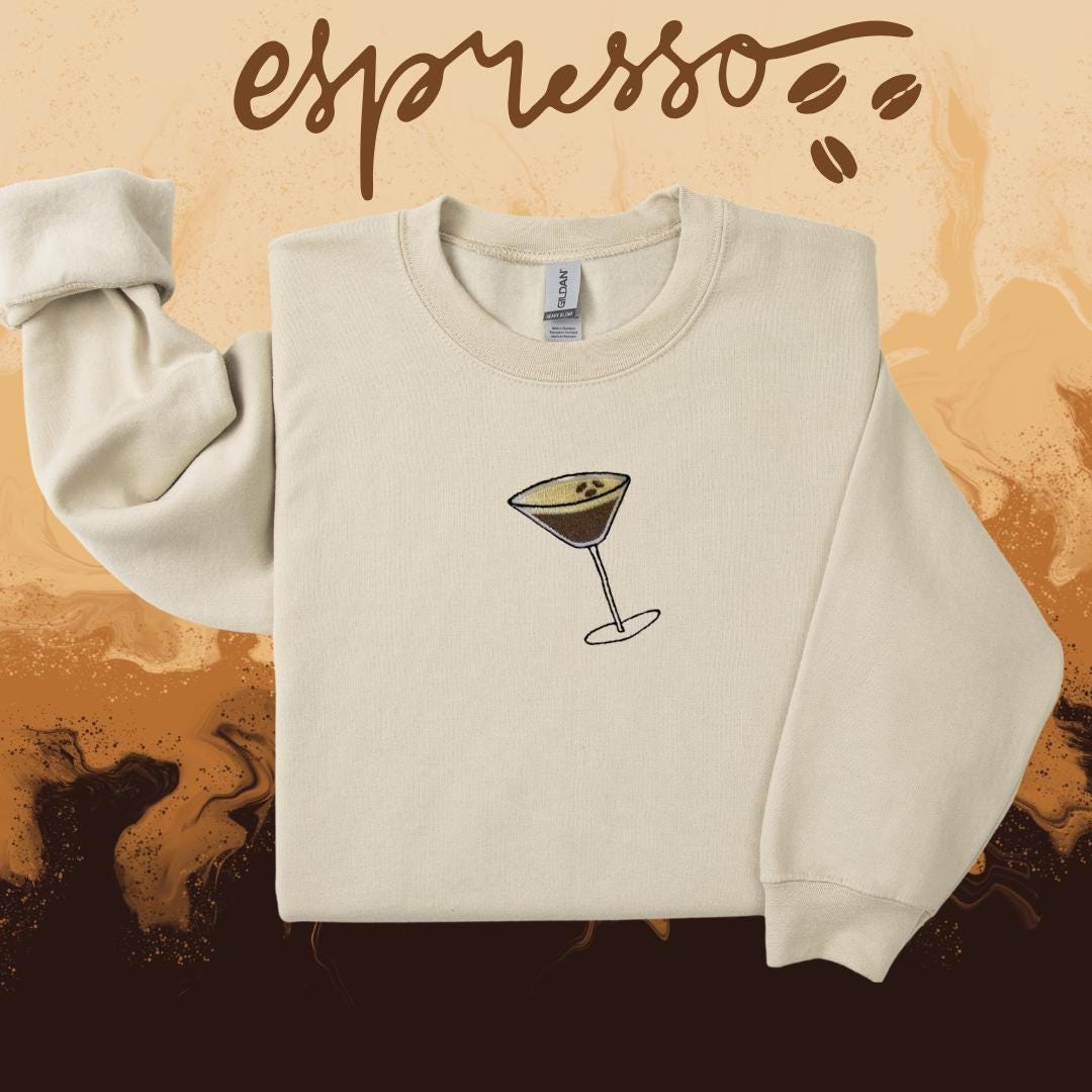 a sweater with a picture of a wine glass on it