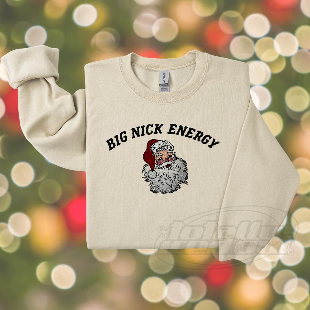 a white sweater with a santa clause on it