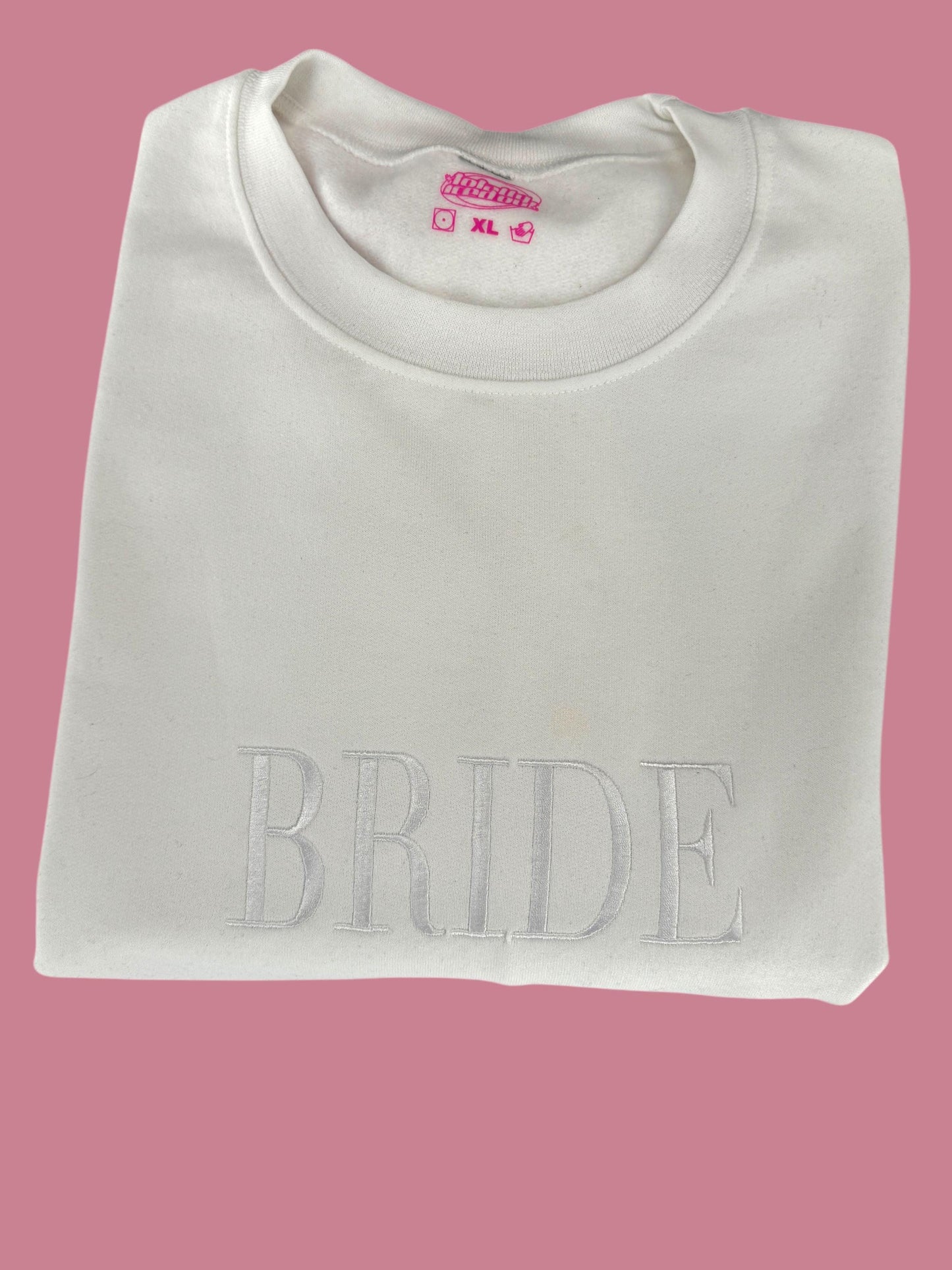 a white t - shirt with the word bride printed on it