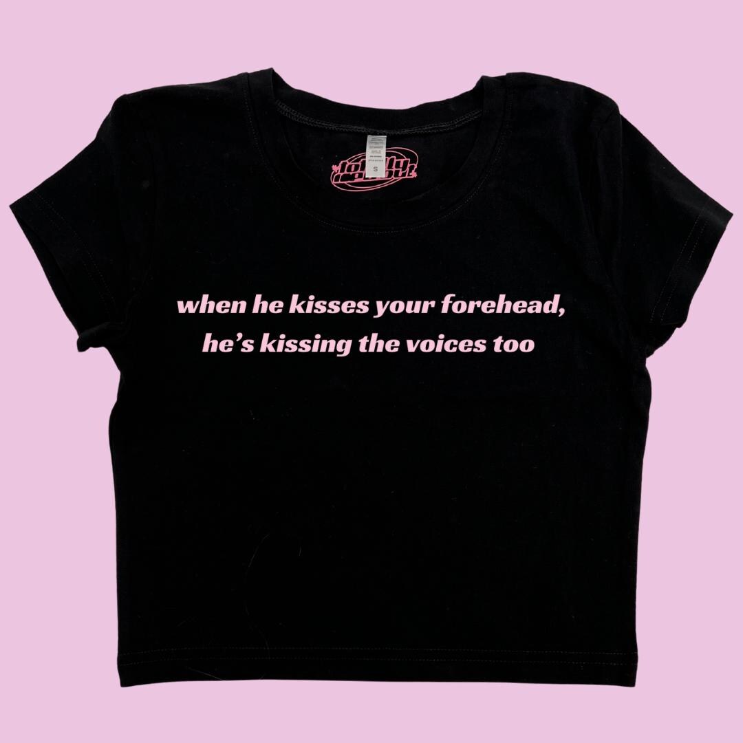 a t - shirt that says when he kisses your forehead, he's kissing