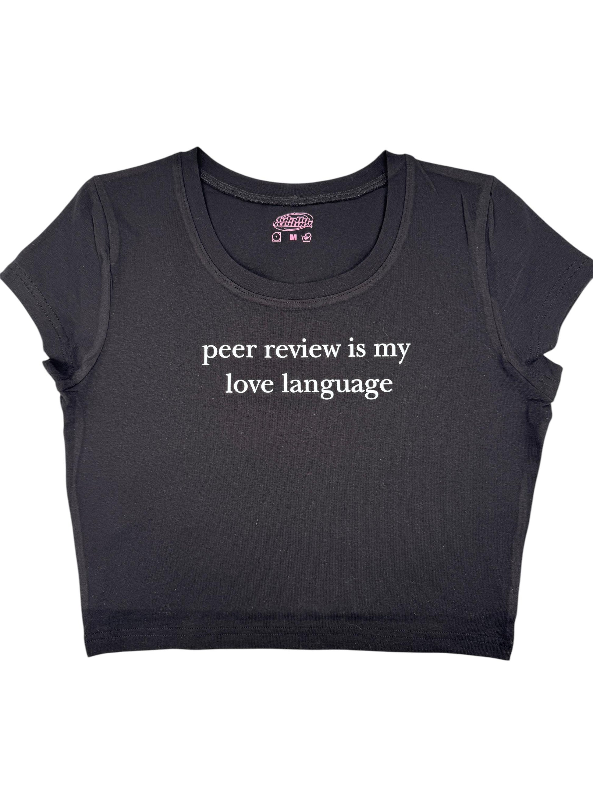 a black crop top with the words peer review is my love language