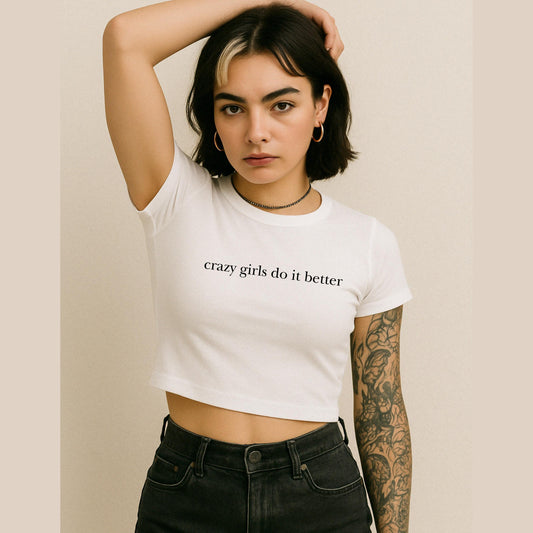 a woman wearing a white crop top with the words crazy girls do it better on