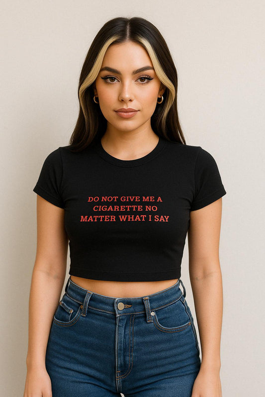 a woman wearing a black shirt that says do not give me a cigarette no matter