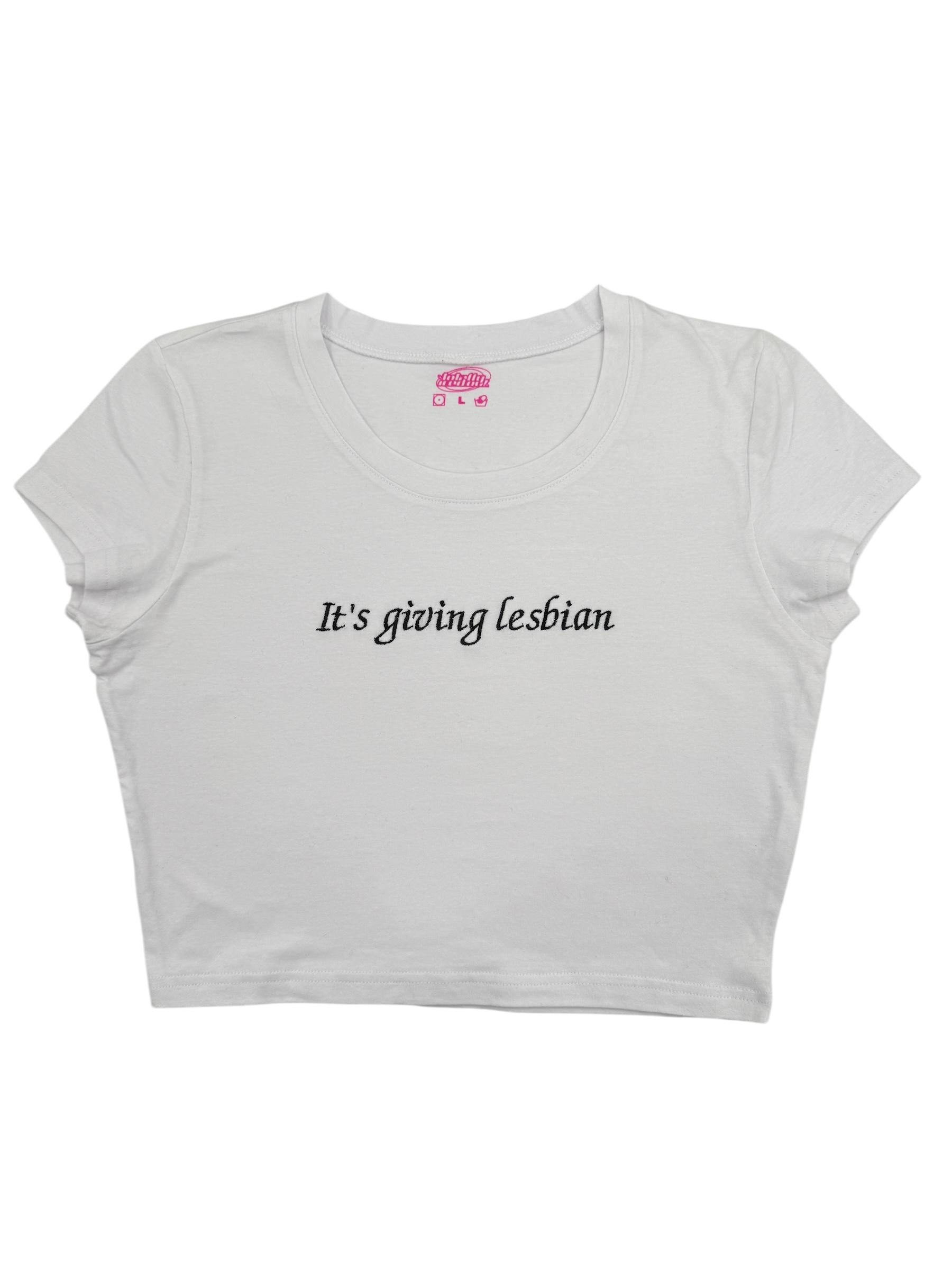a white crop top that says it's going lesbian
