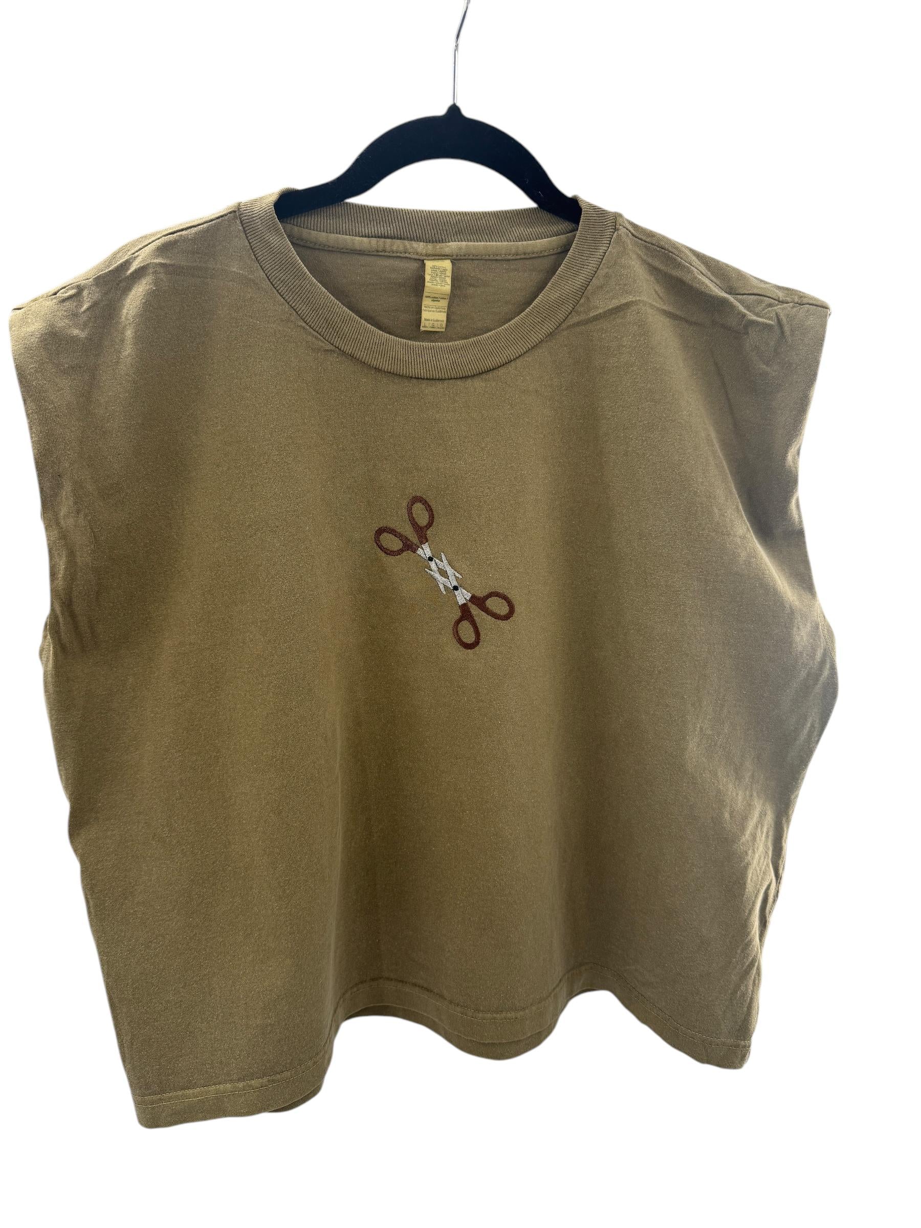 a t - shirt with a pair of scissors on it