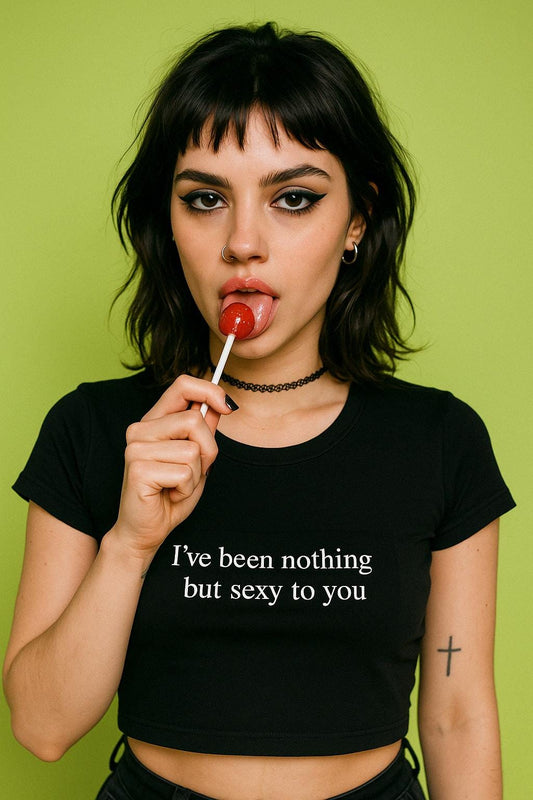 a woman holding a lollipop in her mouth