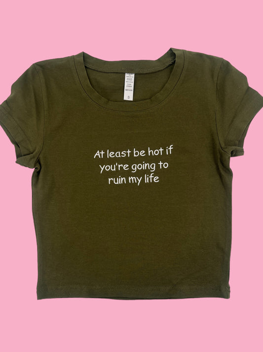 a t - shirt that says at least be hot if you're going to