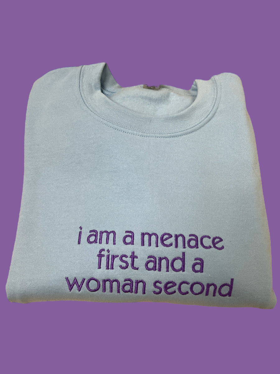 a t - shirt that says i am a menache first and a woman second