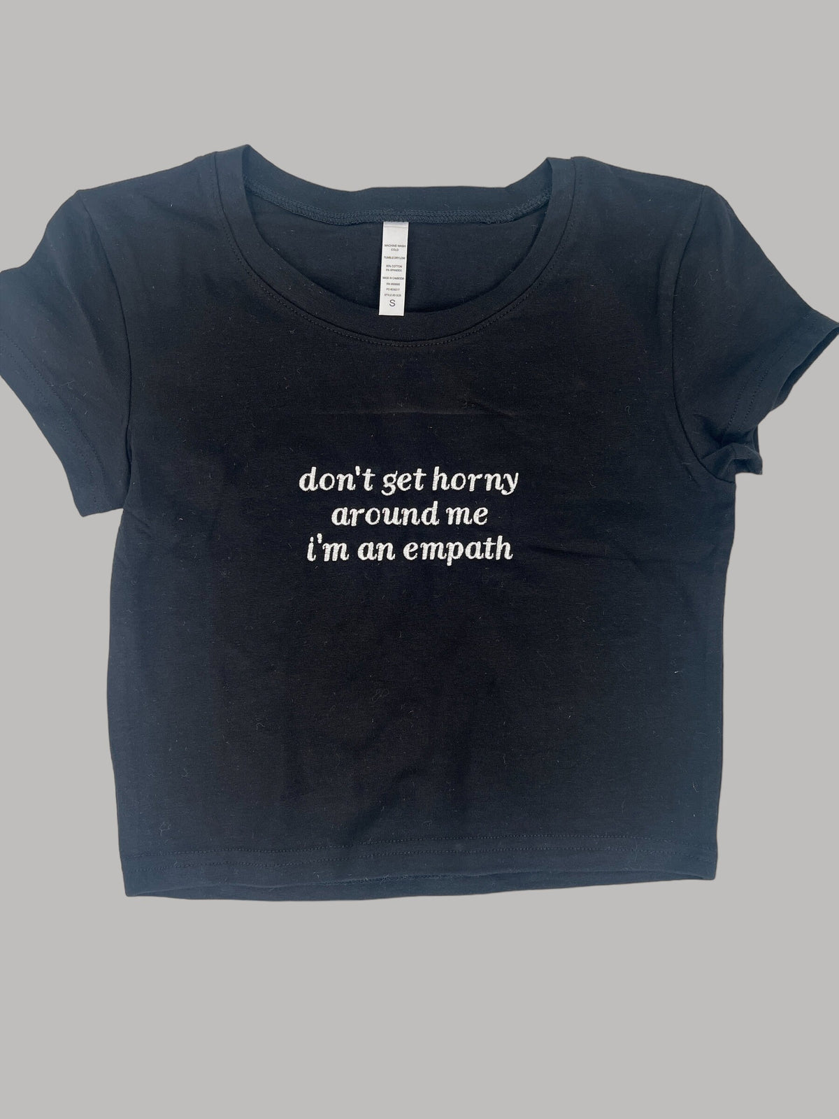 a black t - shirt with the words don&#39;t get horny, stand