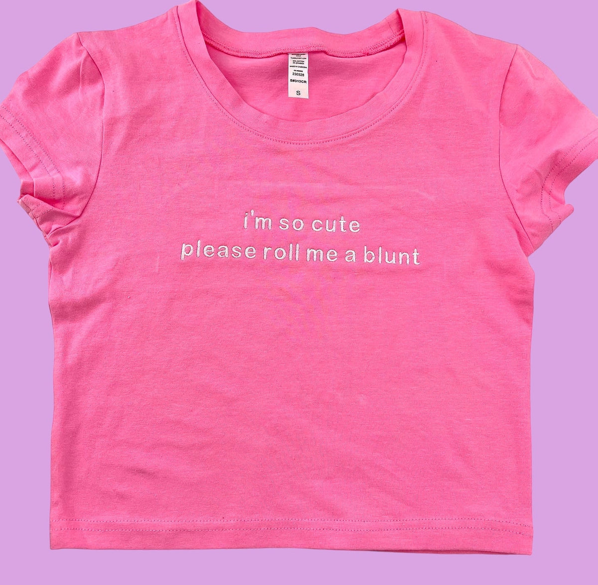 a pink shirt that says i&#39;m so cute please roll me a blunt