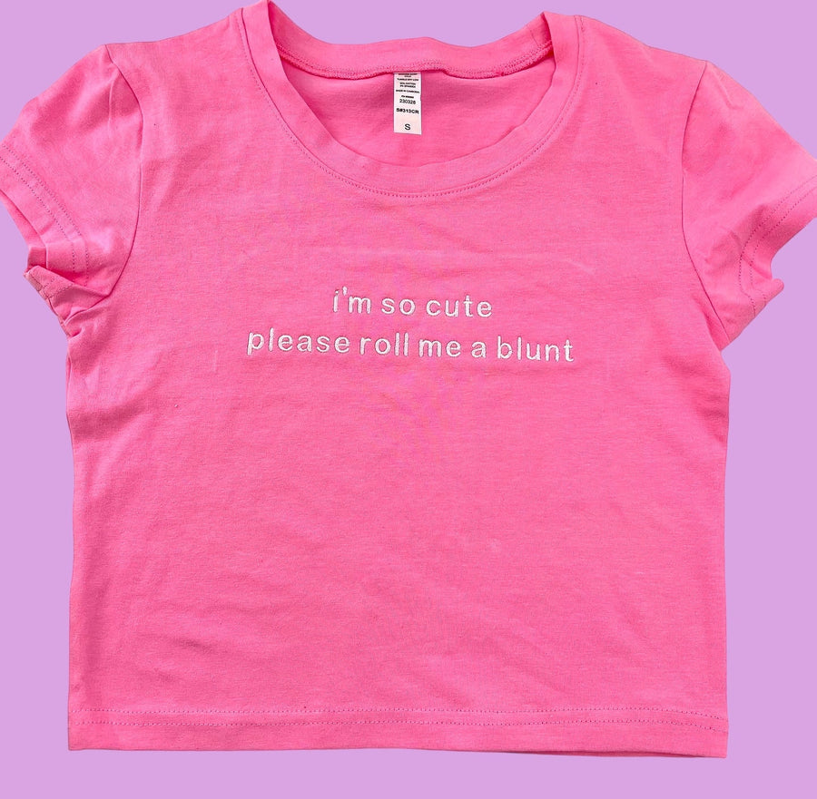 a pink shirt that says i&#39;m so cute please roll me a blunt